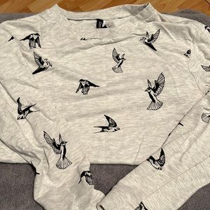 Cute sweatshirt. H&M size Medium. Grey with black hummingbirds. Light weight.